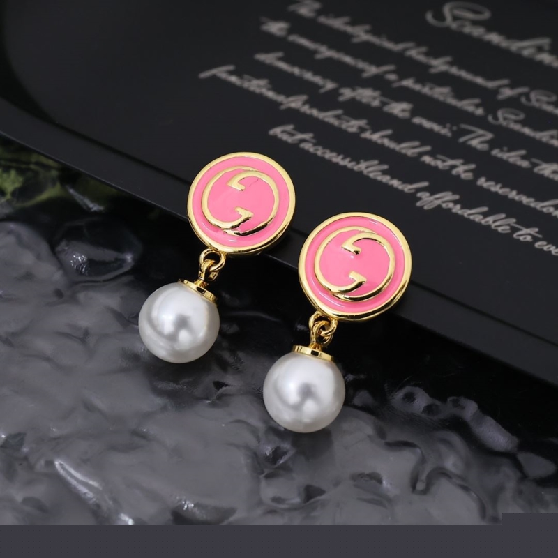 G*u*i earrings